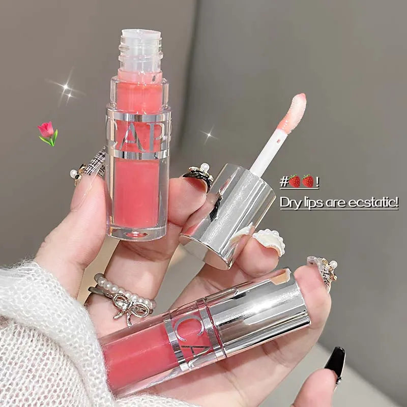 Mirror-like, moisturizing glass lip gloss with long-lasting, clear, plumping, and lip line-reducing properties. Lip gloss.